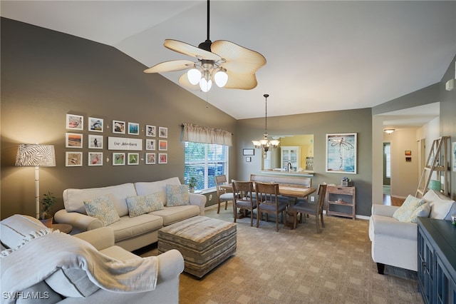 carpeted living room with ceiling fan with notable chandelier and vaulted ceiling