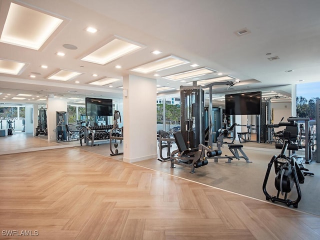 gym featuring light parquet flooring