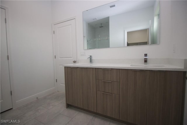 bathroom with vanity and walk in shower