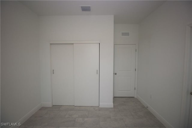 unfurnished bedroom featuring a closet