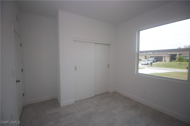 unfurnished bedroom featuring a closet