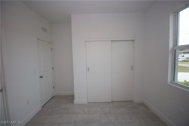 unfurnished bedroom with a closet