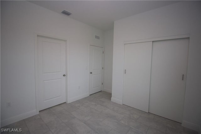 unfurnished bedroom featuring a closet