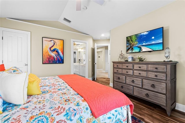 bedroom with vaulted ceiling, ensuite bath, ceiling fan, and dark wood-type flooring