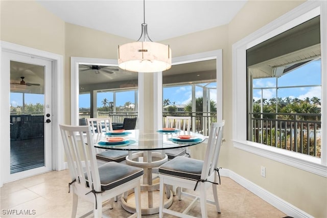 dining space featuring ceiling fan, plenty of natural light, and light tile patterned floors