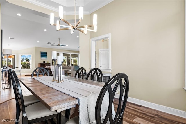 dining room featuring hardwood / wood-style flooring, ceiling fan with notable chandelier, and ornamental molding