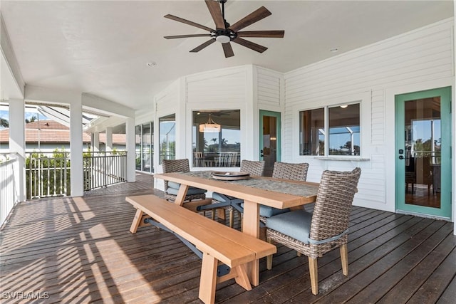 sunroom featuring ceiling fan