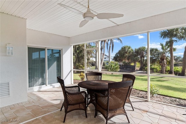 sunroom / solarium with ceiling fan