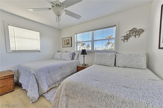 bedroom featuring light wood-type flooring and ceiling fan