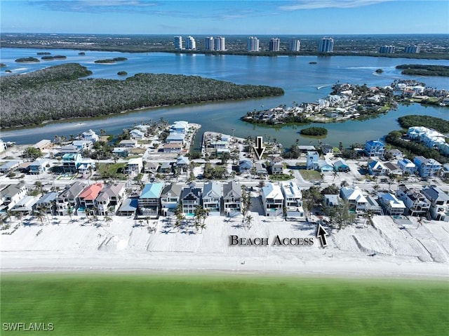 bird's eye view with a view of the beach and a water view