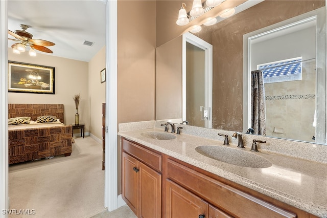 bathroom featuring vanity and ceiling fan