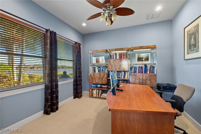 office area featuring light colored carpet and ceiling fan