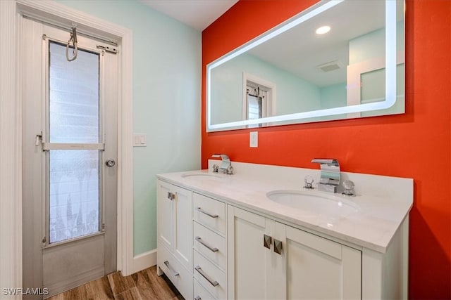 bathroom featuring vanity and wood-type flooring