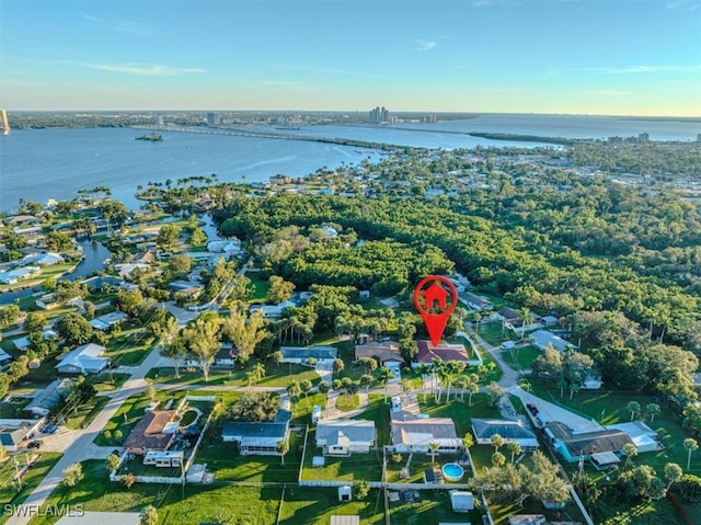 birds eye view of property featuring a water view