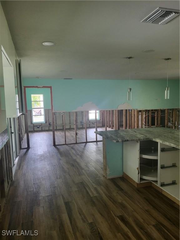 hallway with dark hardwood / wood-style floors