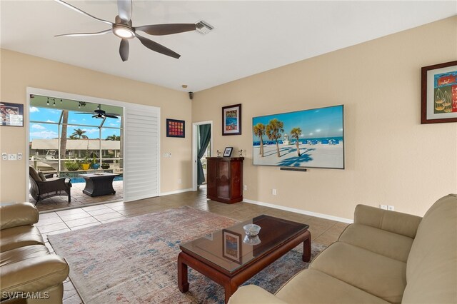 tiled living room with ceiling fan