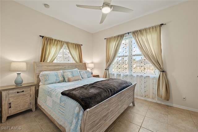 tiled bedroom with ceiling fan