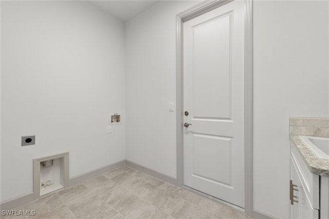 laundry room featuring electric dryer hookup, cabinets, and hookup for a washing machine