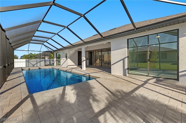 view of pool with a lanai and a patio area