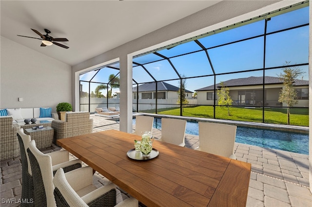 view of patio / terrace featuring ceiling fan, a lanai, and an outdoor hangout area