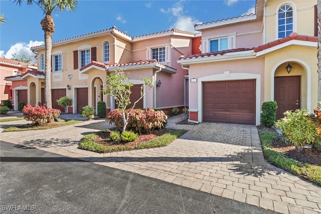 mediterranean / spanish-style home featuring a garage