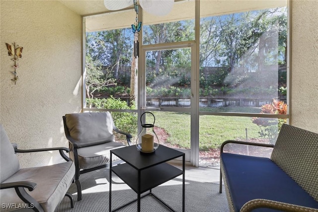 sunroom / solarium with ceiling fan