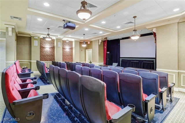 cinema room featuring carpet, ornamental molding, and coffered ceiling