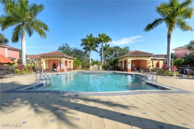 view of swimming pool featuring a patio area