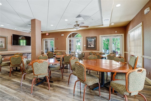 dining area with ceiling fan, french doors, and hardwood / wood-style floors