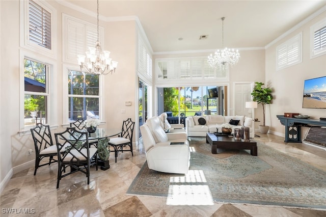 living room featuring ornamental molding, a high ceiling, and a chandelier