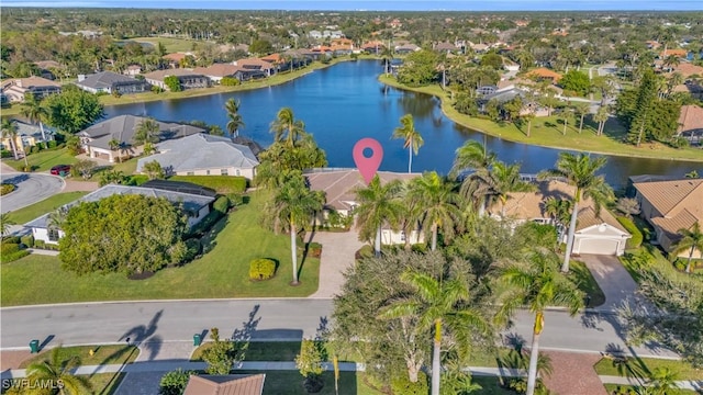 birds eye view of property featuring a water view