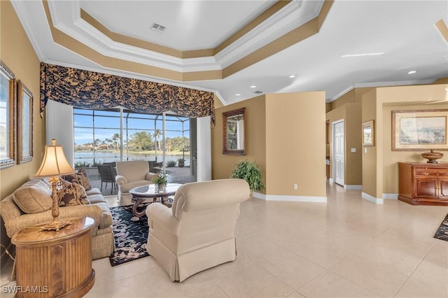 living room featuring a raised ceiling, light tile patterned floors, and crown molding