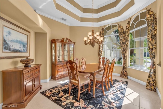 dining space with a chandelier, light tile patterned floors, and ornamental molding