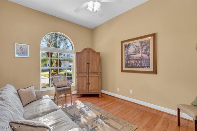 sitting room featuring light hardwood / wood-style flooring and ceiling fan