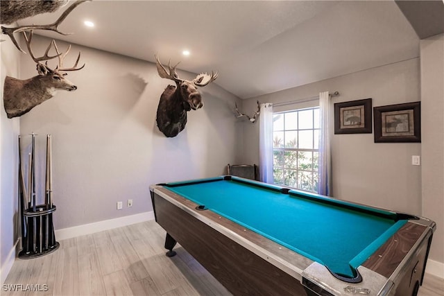 recreation room with light wood-type flooring, lofted ceiling, and pool table