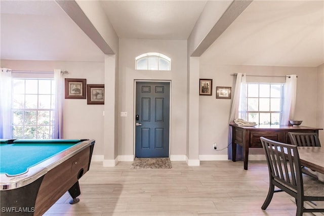 foyer entrance with light hardwood / wood-style flooring and billiards