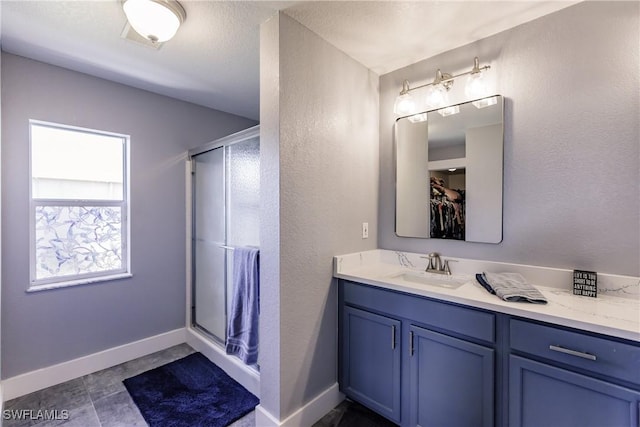 bathroom featuring vanity and walk in shower