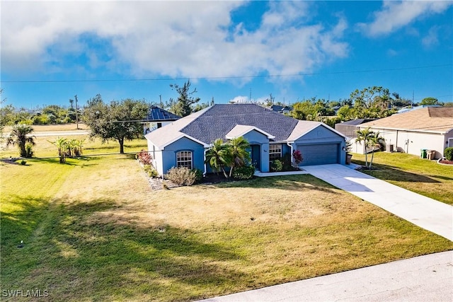 ranch-style house featuring a front lawn and a garage