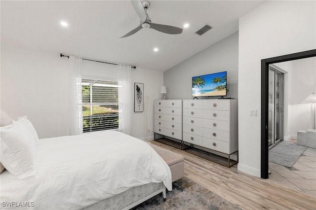 bedroom featuring ceiling fan, light hardwood / wood-style flooring, and vaulted ceiling