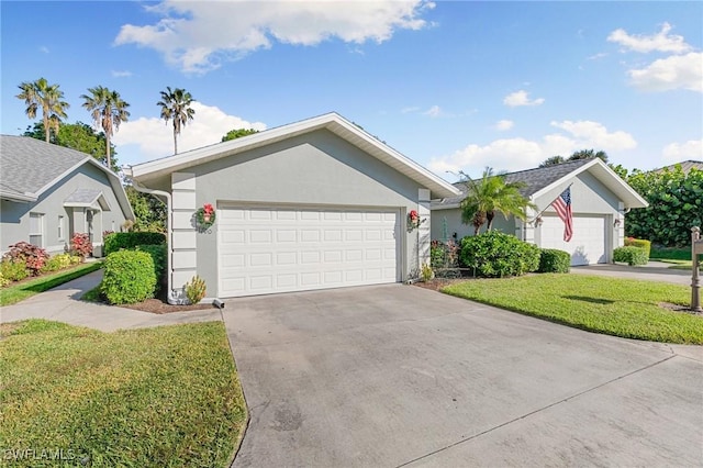 ranch-style home featuring a front lawn and a garage