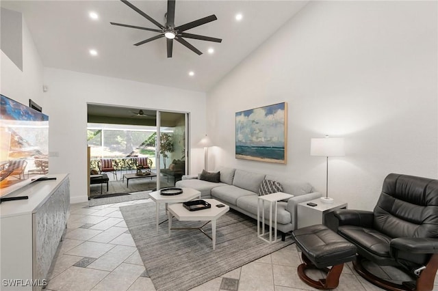 living room featuring ceiling fan, high vaulted ceiling, and light tile patterned floors