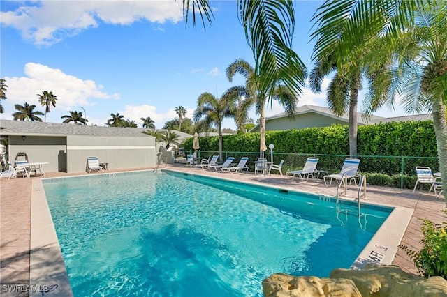 view of swimming pool featuring a patio area