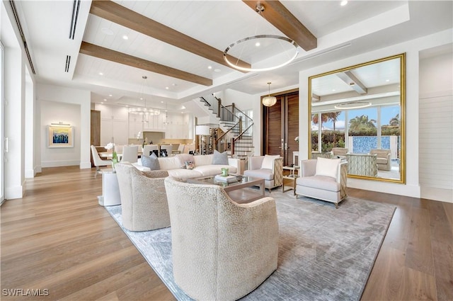 living room with light wood-style floors, stairs, beam ceiling, and recessed lighting