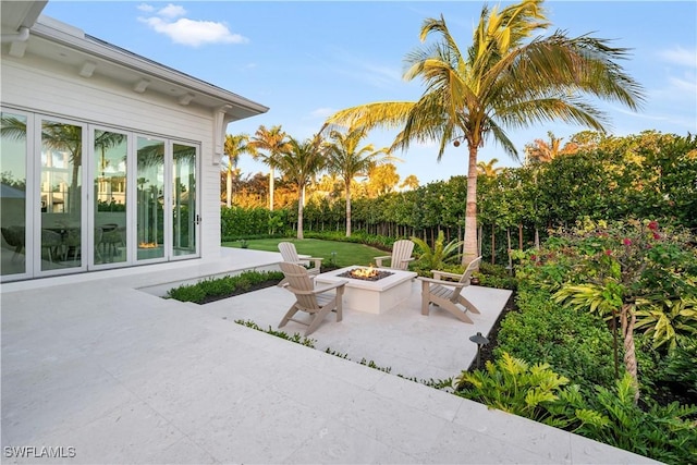 view of patio / terrace featuring an outdoor fire pit