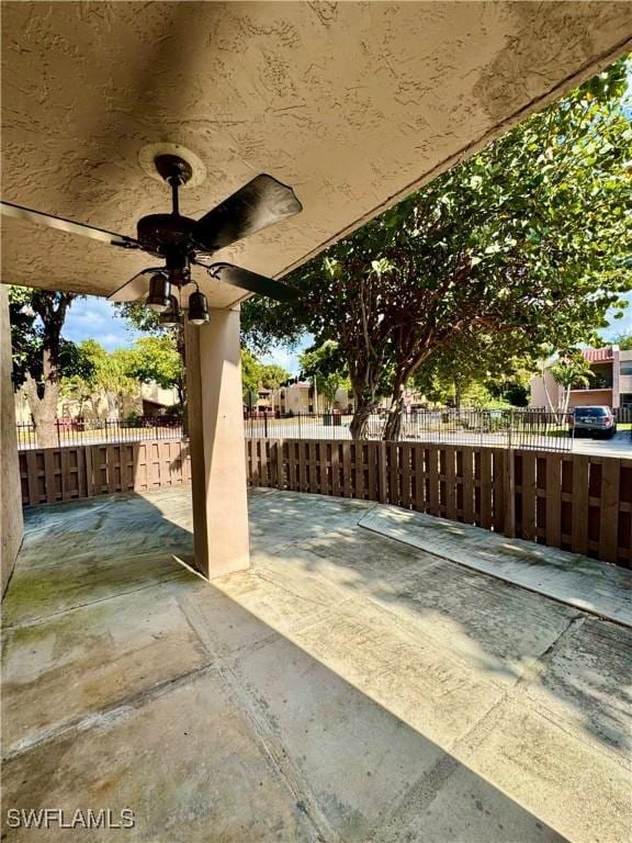 view of patio featuring ceiling fan