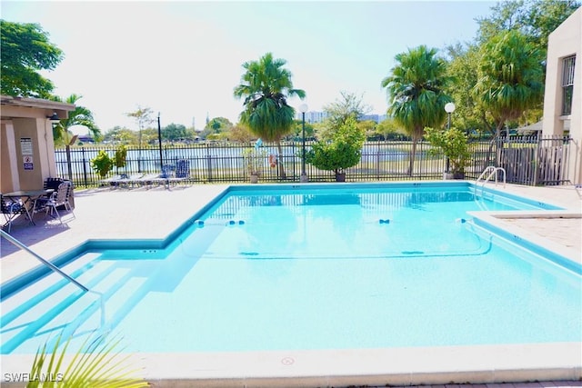 view of swimming pool with a patio