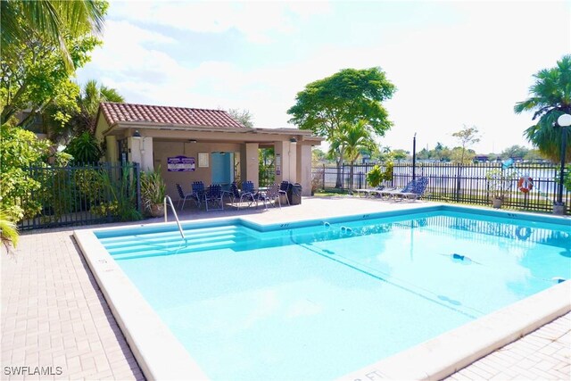 view of swimming pool featuring a patio area