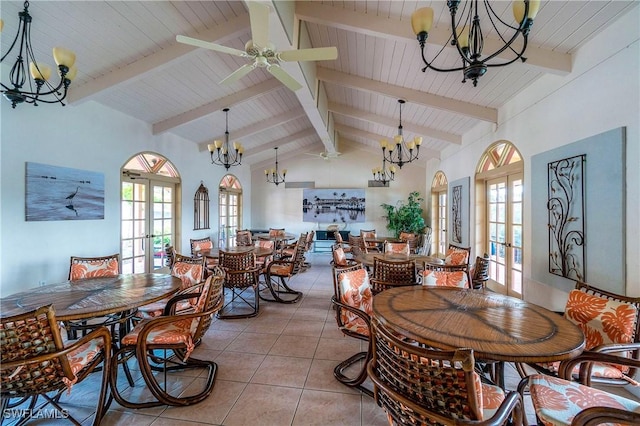 dining area with ceiling fan, french doors, high vaulted ceiling, and light tile patterned flooring