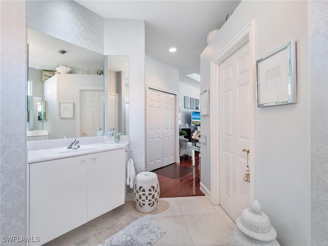 bathroom with vanity and wood-type flooring