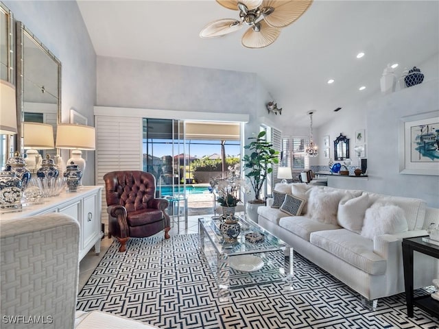 living room featuring ceiling fan and high vaulted ceiling